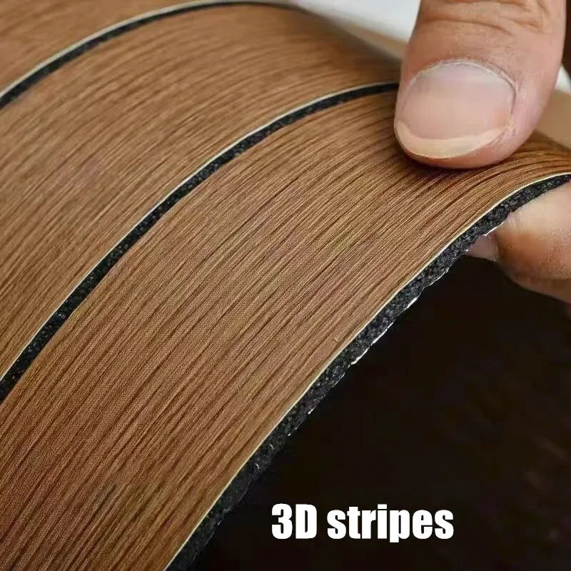 Close-up of a roll of brown wood grain self-adhesive wallpaper showing 3D stripes being unrolled.