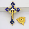Antique-style crucifix figurine featuring a gold-toned cross with a figure of Christ and a blue enamel pendant on a gold stan