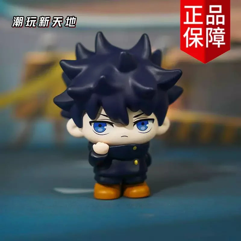 A collectible figure of Gojo and Geto from Jujutsu Kaisen, featuring dark blue hair and clothing.