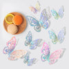 A set of 3D hollow butterfly wall stickers in gold and silver metallic decor, displayed with citrus fruit slices.