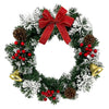 A 10-inch artificial Christmas wreath decorated with evergreen branches, red berries, and a velvet bow.