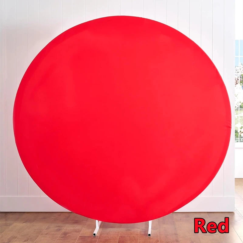A large, circular red photo backdrop suspended on a stand.
