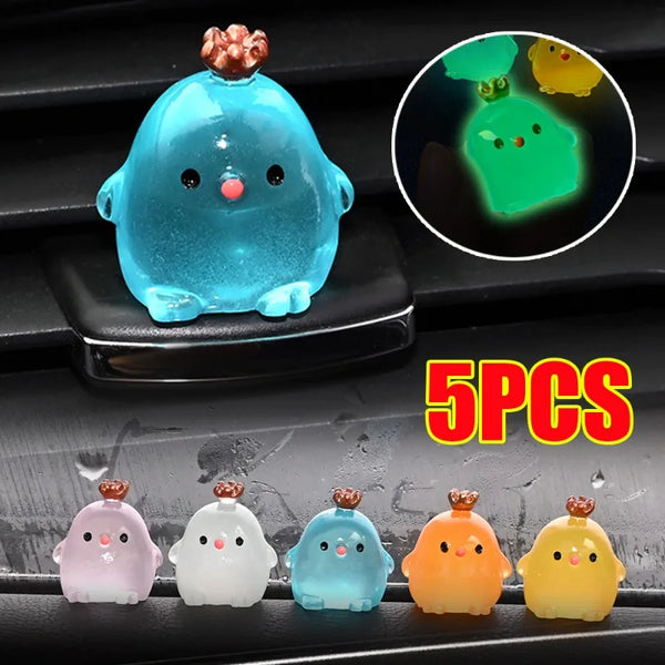 Five colorful luminous resin chicken car ornaments displayed on a black surface with a magnified view of one