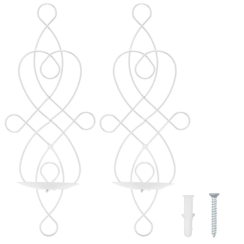 A set of white decorative iron wall candle sconces with an intertwined, swirling design.