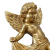 A golden cherub angel sculpture with feathered wings and draped fabric.
