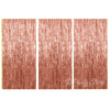 Three panels of metallic rose gold foil fringe curtains for party backdrop decor