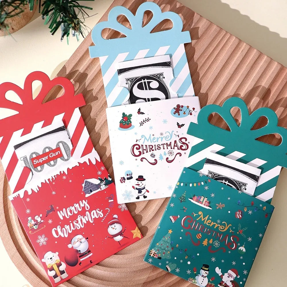 A set of three colorful cartoon Christmas thank you cards with festive designs displayed on a wooden surface.