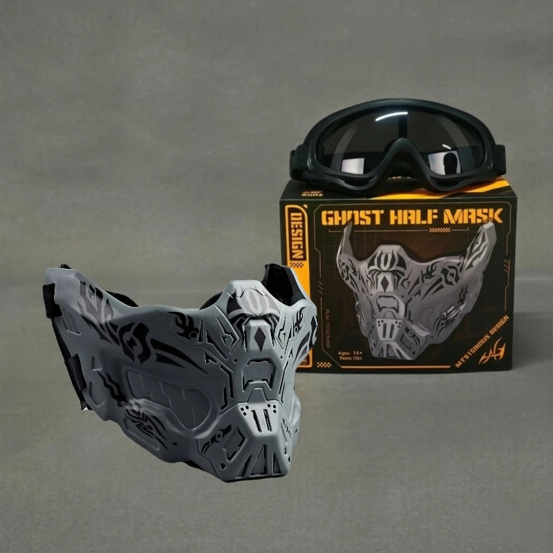 A gray tactical silicone half-face mask is displayed next to its packaging and a pair of goggles.
