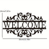 Black metal wall art with the word WELCOME in an elegant script font