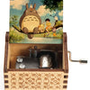 Hand-cranked wooden music box featuring a Totoro design on the lid.