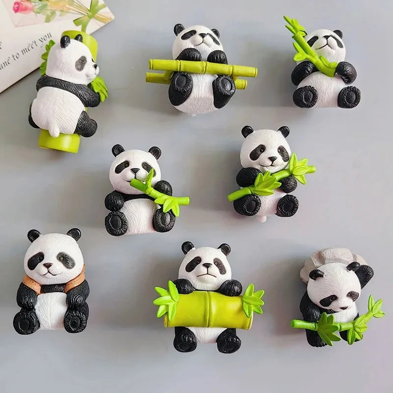 A collection of cute 3D panda fridge magnets in various poses and colors.