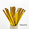 A bundle of 25 gold disposable dinnerware sticks or straws in a white container.