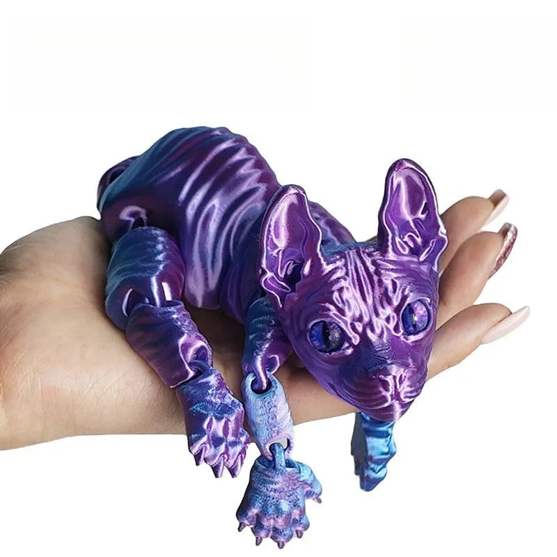 A purple articulated sphynx cat figurine is held in a hand, showcasing its detailed texture and poseable features.