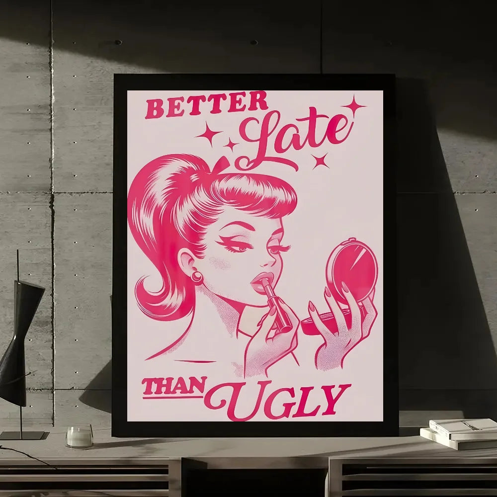 A framed print featuring a stylized illustration of a woman with pink hair, saying Better Late Than Ugly.