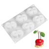 A silicone raspberry mousse mold with six cavities used for baking or dessert making.