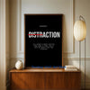 A framed piece of motivational wall art featuring the word DISTRACTION in white text on a black background.