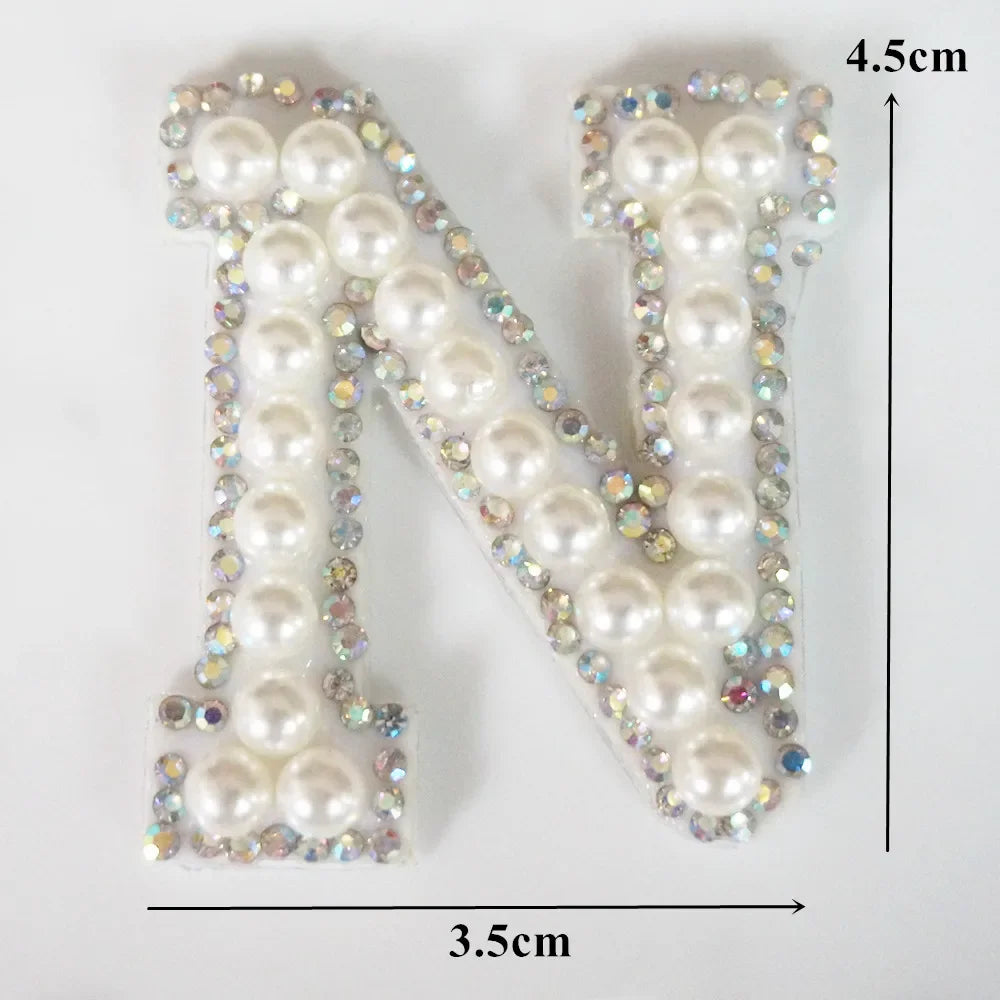 A white pearl alphabet letter N rhinestone patch measuring 4.5cm high and 3.5cm wide.