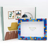 A DIY photo frame featuring a blue and yellow starry sky design with decorative blocks.