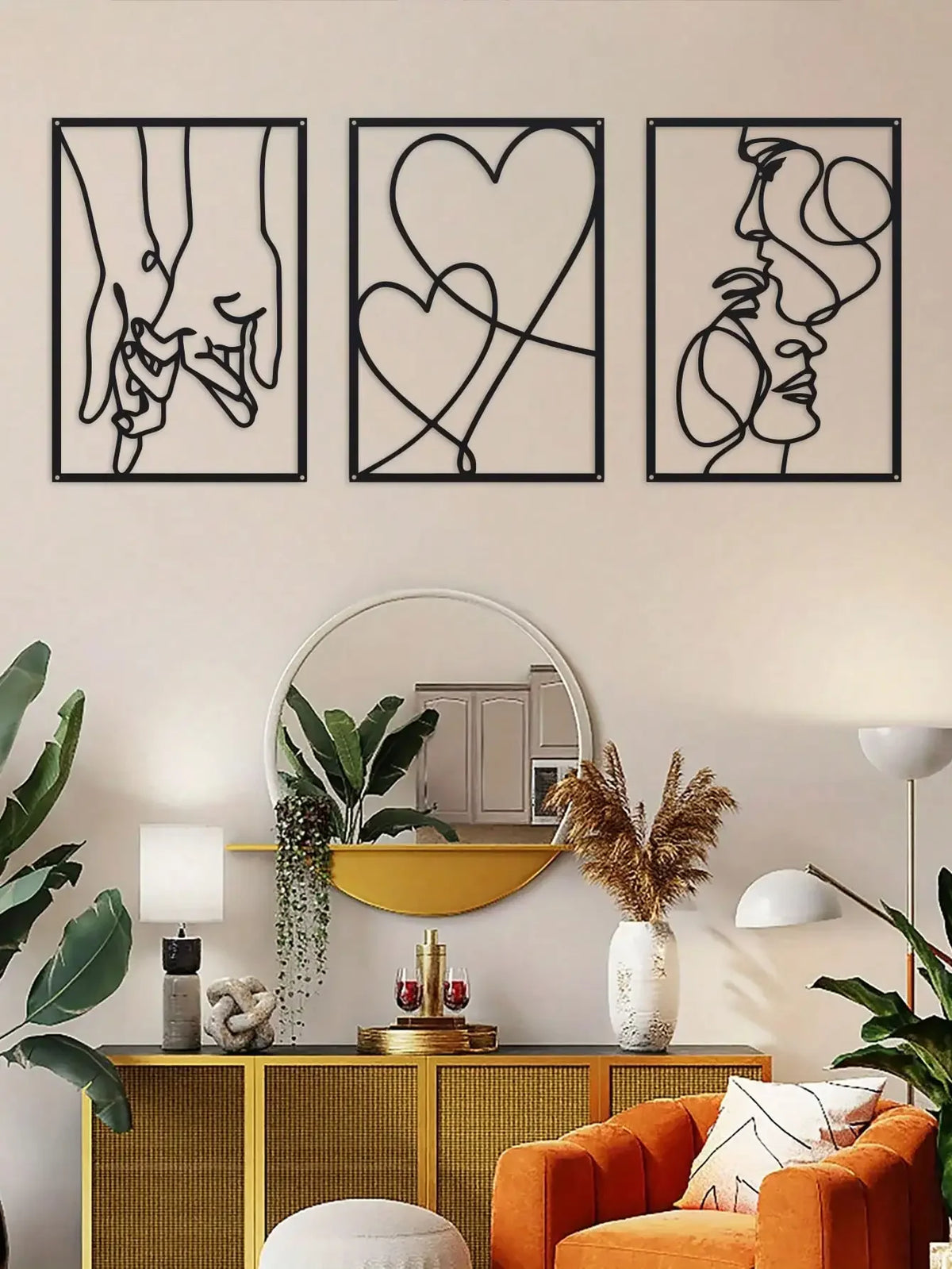 A set of three black metal line art prints depicting holding hands, a heart, and a profile of a face.