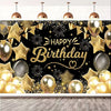 Elegant black and gold birthday party backdrop featuring balloons, confetti, and gold streamers.