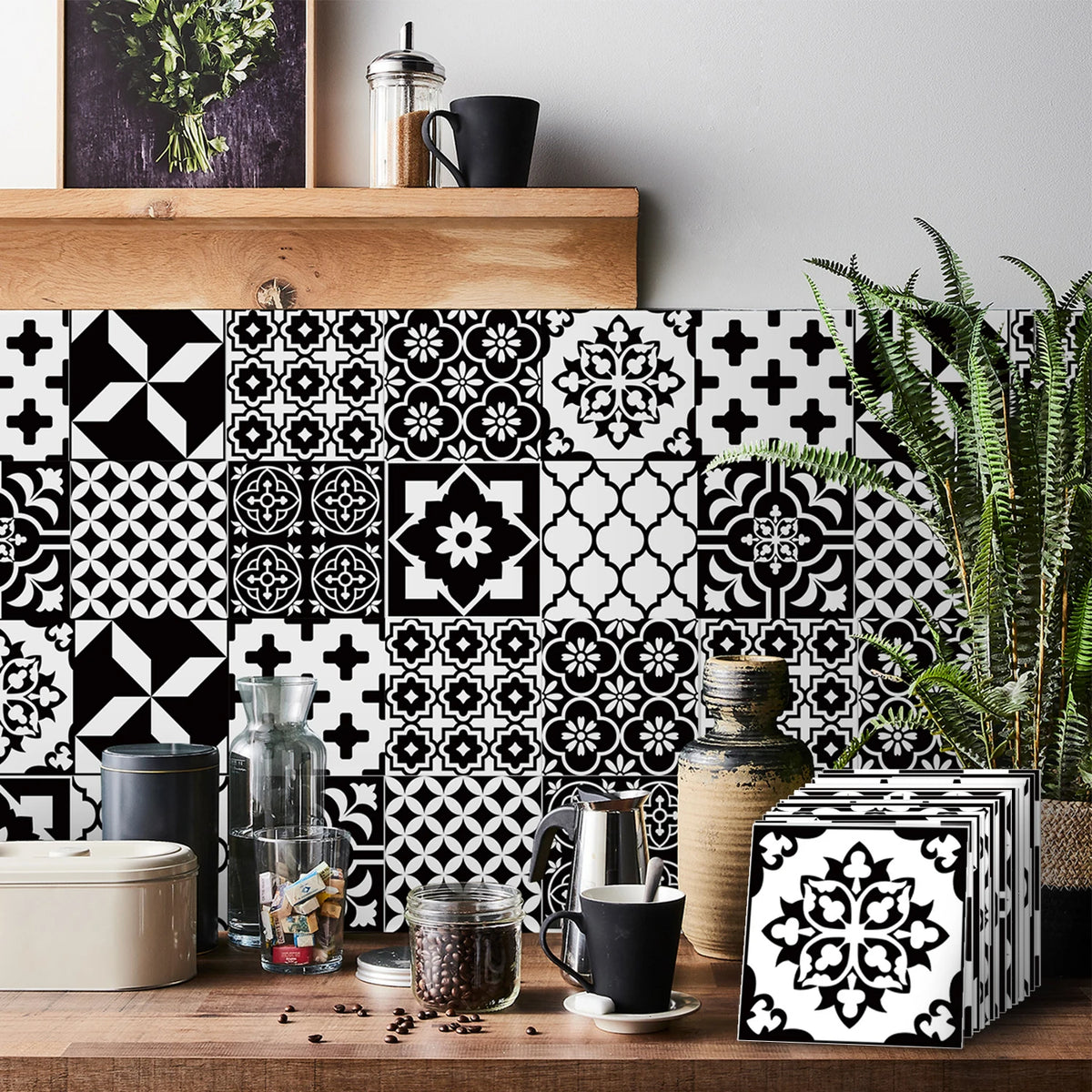Black and white geometric tile wall stickers featuring floral and cross patterns on a wooden surface.