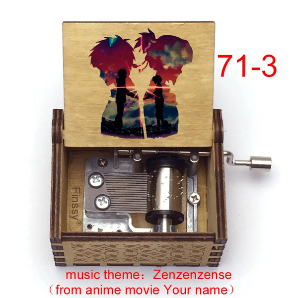 A wooden music box ornament featuring a painted scene of two silhouettes against a sunset background.