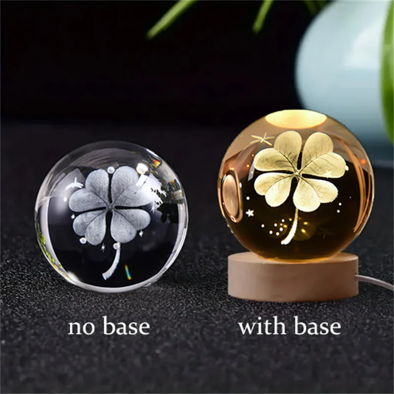 A comparison of a 3D crystal ball night light without a base and with a wooden base.
