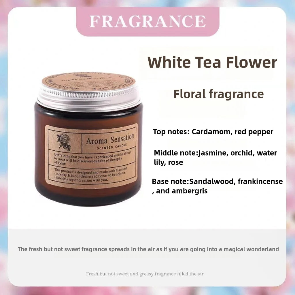 A jar of White Tea Flower floral fragrance candle with a cork lid and a label detailing the scent notes.