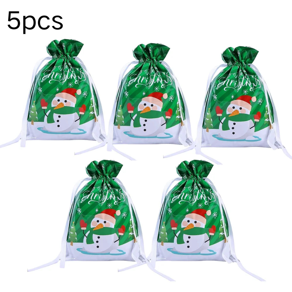Five reusable green and white Christmas drawstring gift bags with snowflake designs