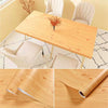 Roll of self-adhesive wood grain wallpaper showing the natural texture and grain pattern.