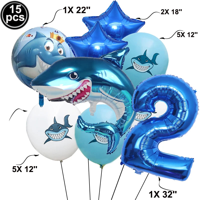 A collection of blue shark foil balloons in various sizes and shapes for an ocean-themed party decoration.