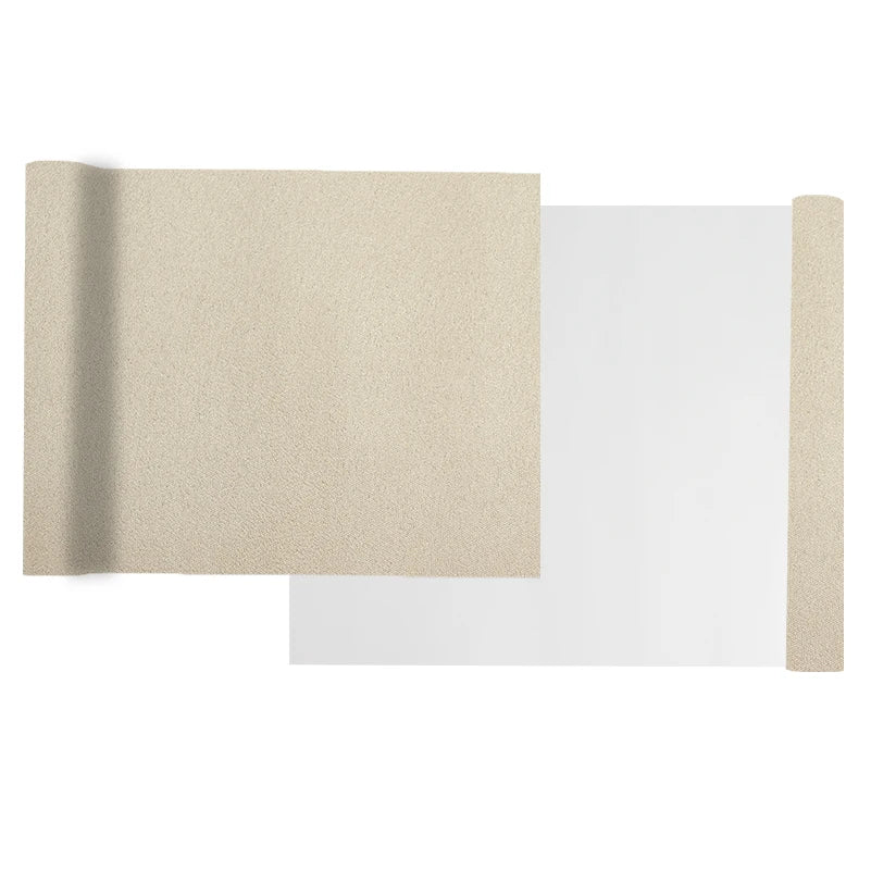 A sheet of beige suede wrap fabric with a white backing and a vertical strip of the same fabric.