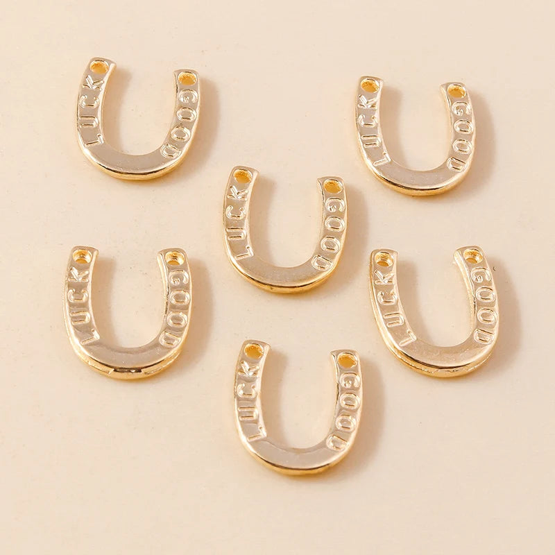 A collection of gold horse charm pendants for handmade jewelry, featuring various shapes and sizes.
