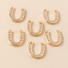 A collection of gold horse charm pendants for handmade jewelry, featuring various shapes and sizes.