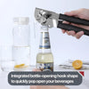 A hand is using an integrated bottle-opening hook shape to quickly pop open a glass bottle.