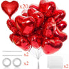 A bundle of twenty red heart foil balloons for Valentine's Day and wedding decorations with accessories.