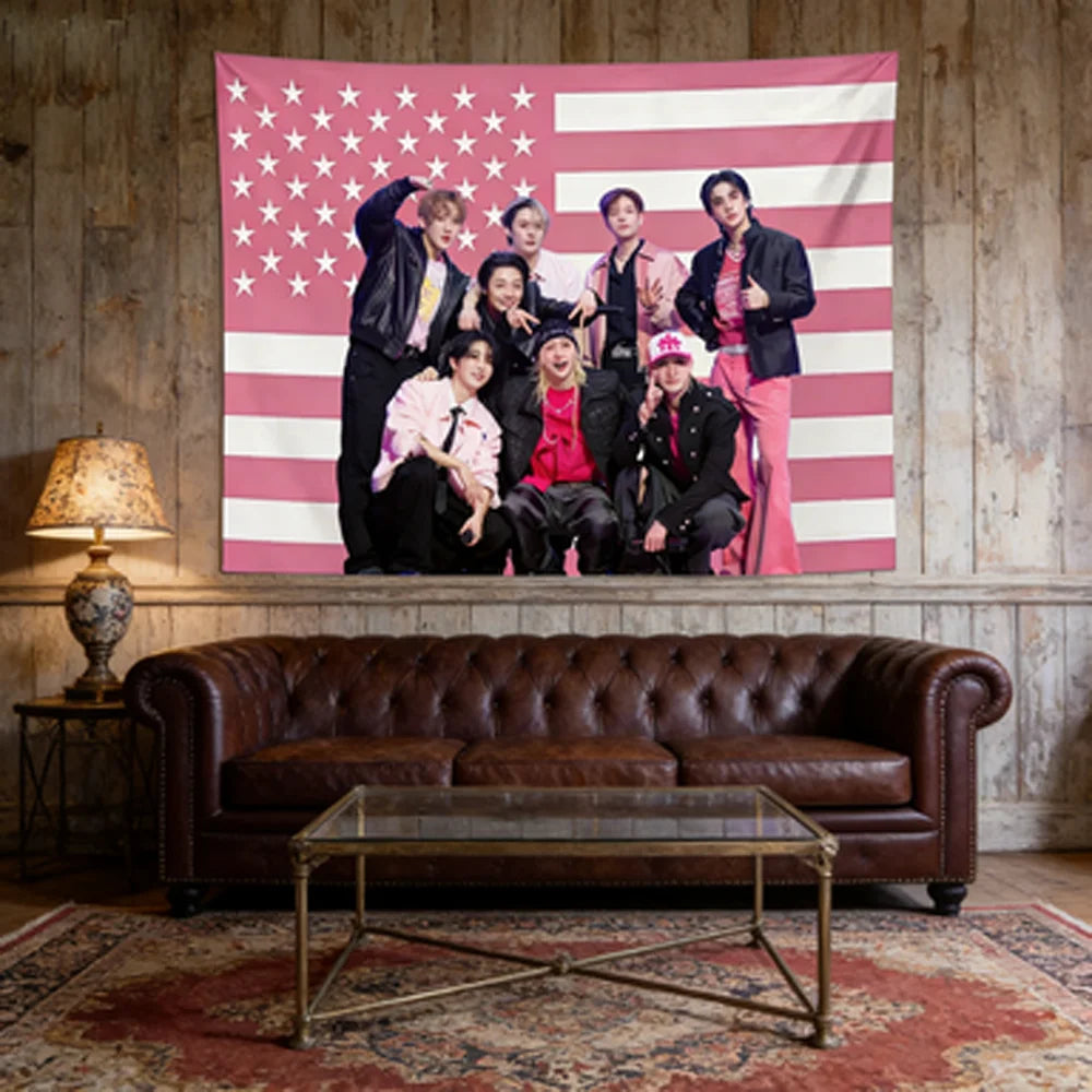 A pink American flag tapestry featuring several Kpop idols posing against the flag backdrop.