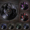 A collection of vintage vinyl record wall clocks showing various silhouettes and a clock face.