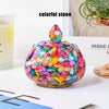 Colorful stone crystal bowl with iridescent and vibrant stones used for meditation and home decor