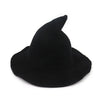 A black vintage knit witch hat with a pointed crown.