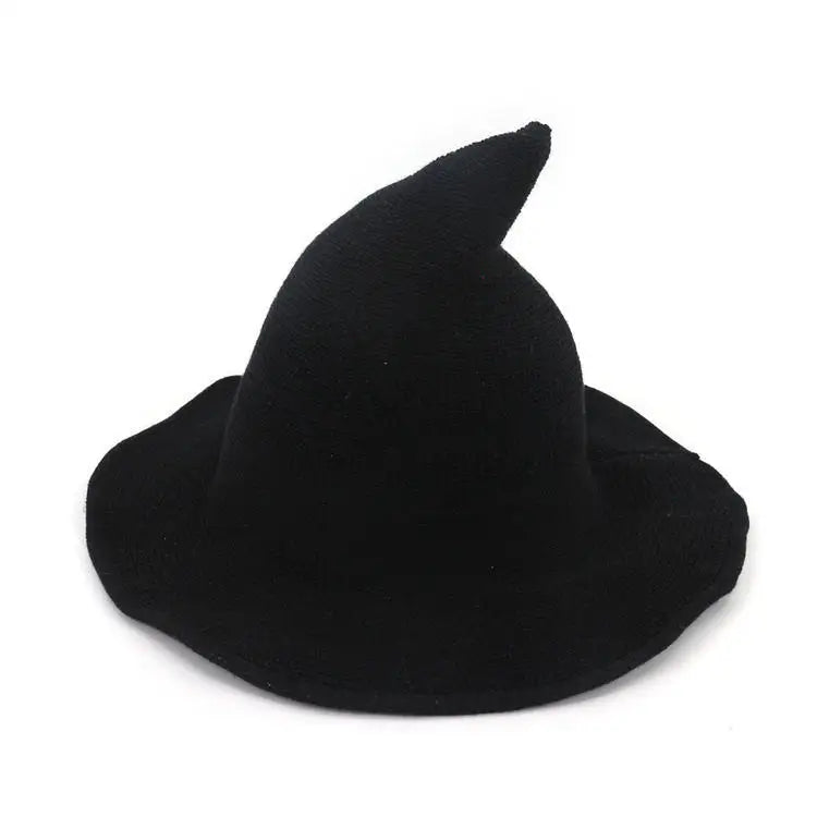 A black vintage knit witch hat with a pointed crown.