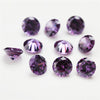 A collection of round cut purple cubic zirconia loose stones of various sizes for jewelry making.