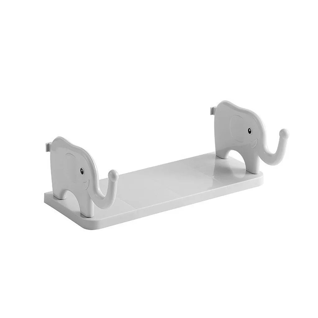 White adhesive elephant storage rack designed for wall organization.