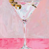 A pink-tinted glass cocktail with olives garnishing the rim, set on a pink surface.