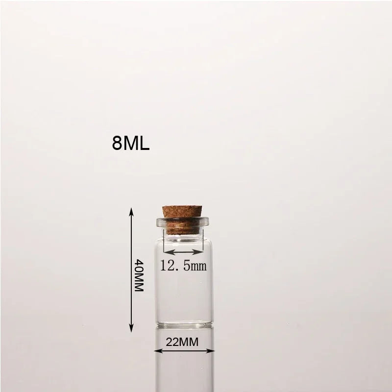 A clear glass bottle with a cork stopper is shown next to a measurement scale indicating 8ML capacity.