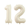 Two beige helium foil number balloons shaped like 1 and 2