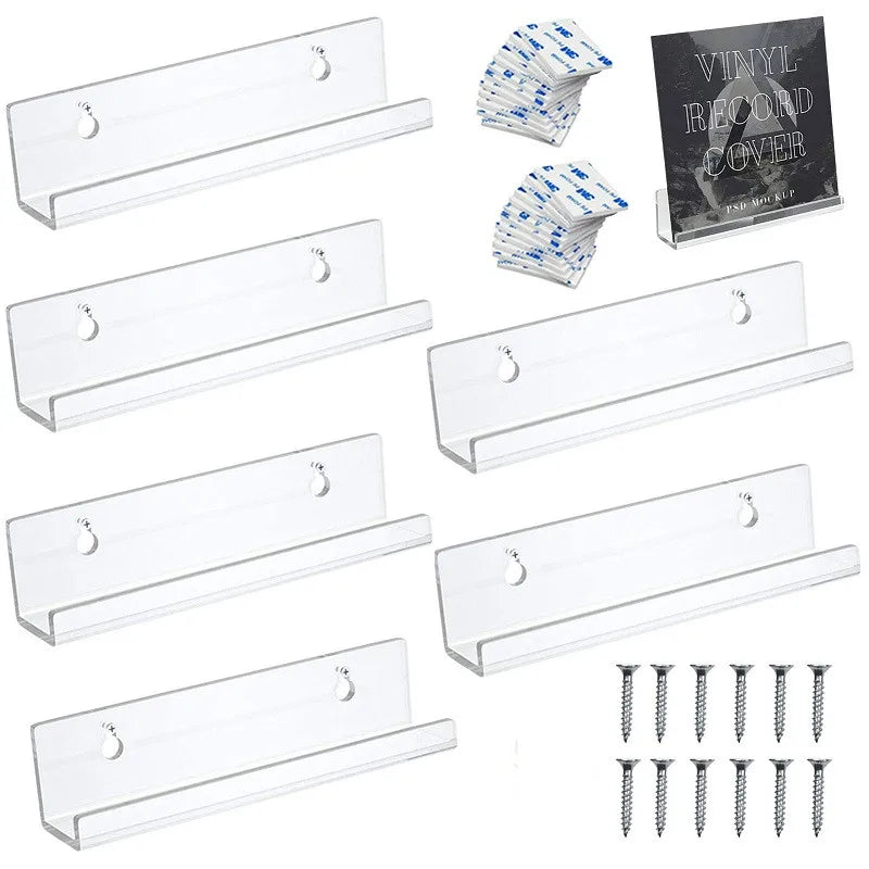 Clear acrylic vinyl record display shelf with stacked vinyl record covers