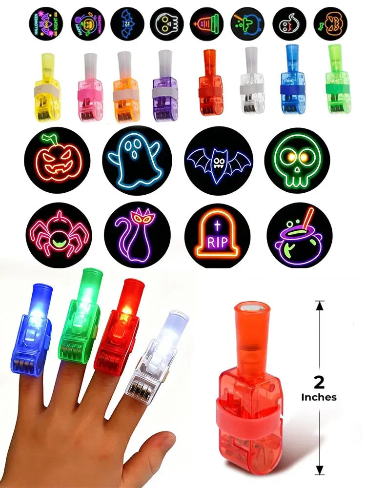 A hand holds a finger projector light with various spooky LED designs, including a pumpkin and skull.