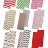 A collection of various colorful striped and polka dot paper drinking straws in different patterns.