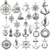 A collection of vintage ship anchor charms and emblems for jewelry making